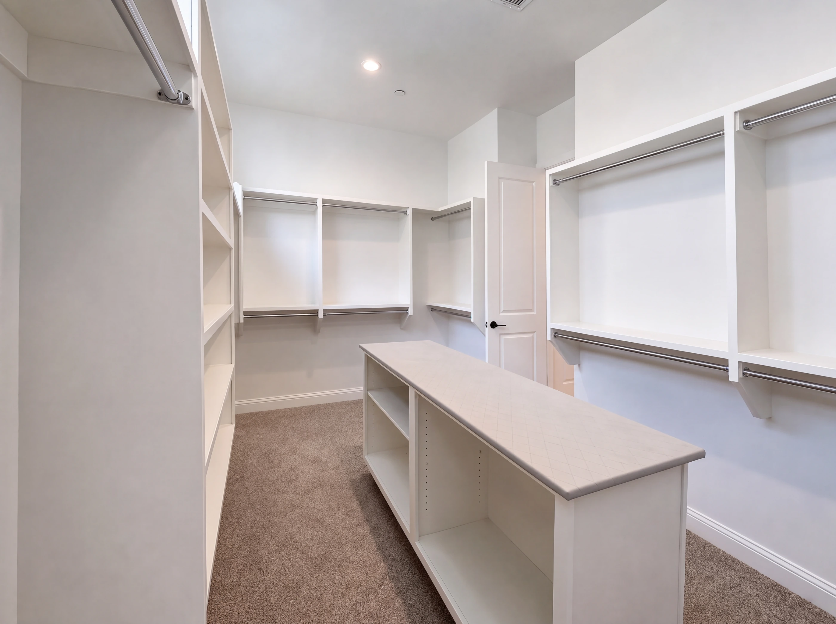 Primary walk-in closet with center island