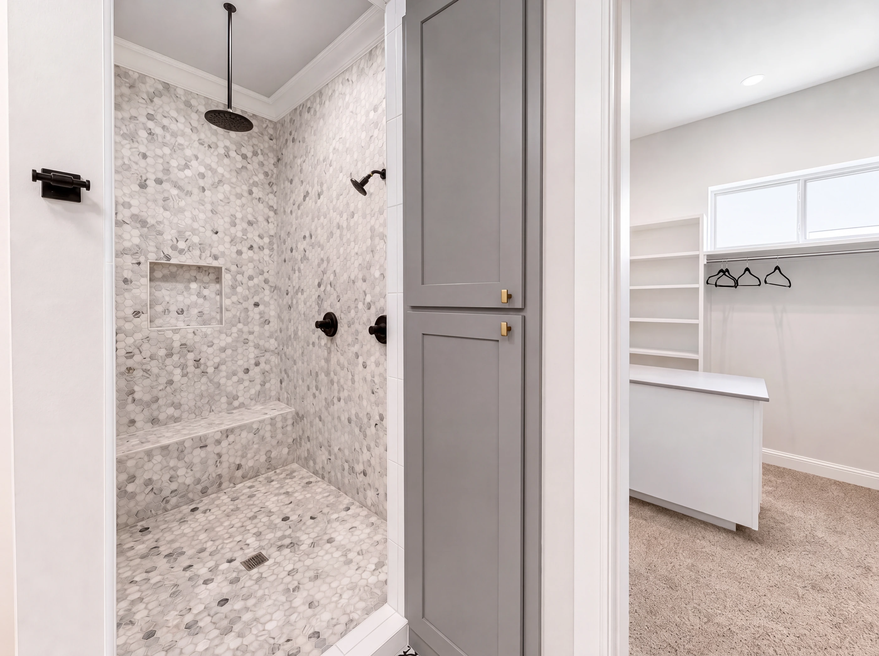 Marble-mosaic walk-in shower with rain head