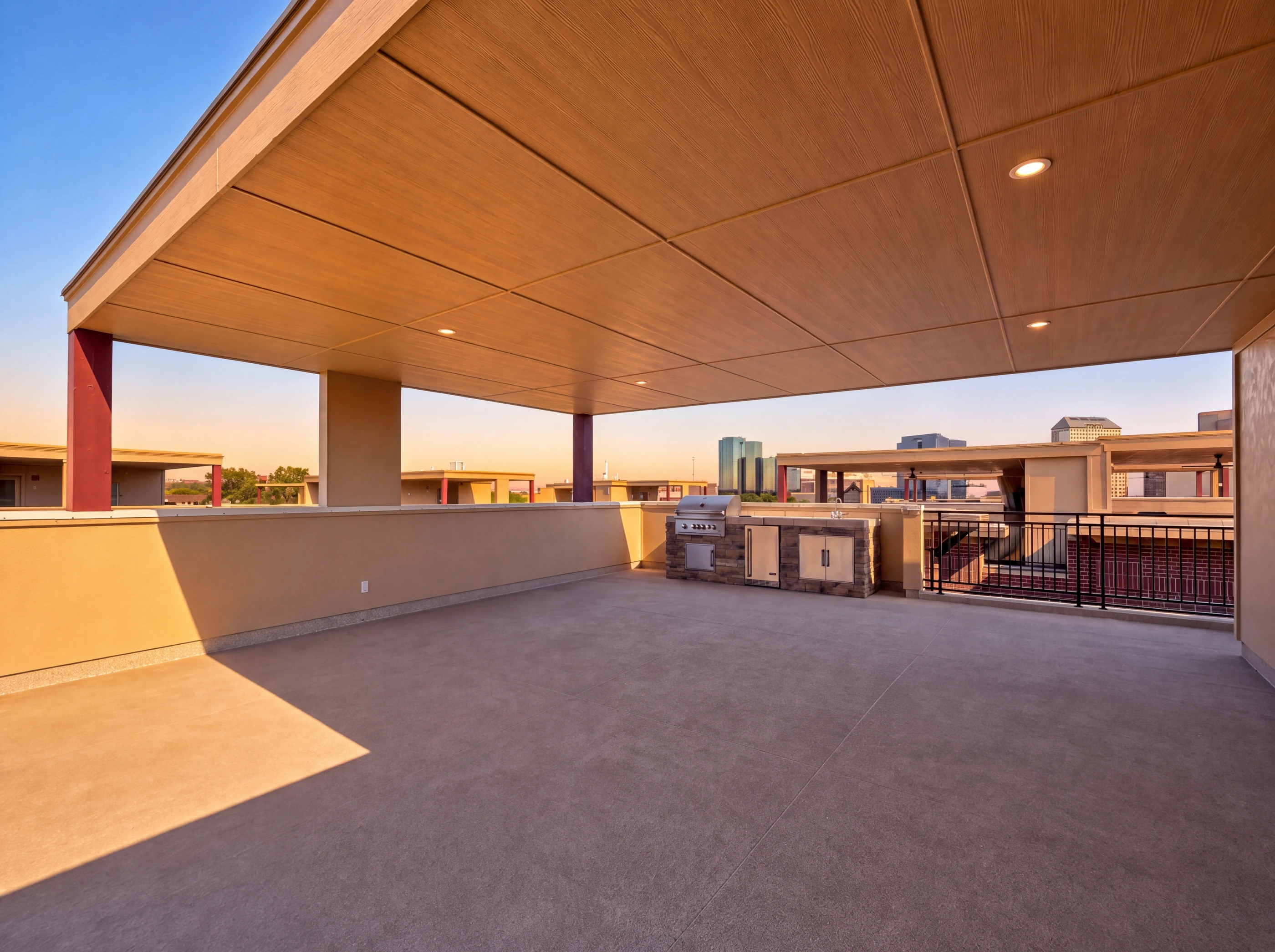 Covered rooftop terrace with outdoor kitchen and skyline view